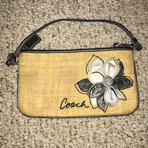 Coach wristlet straw with leather flower
